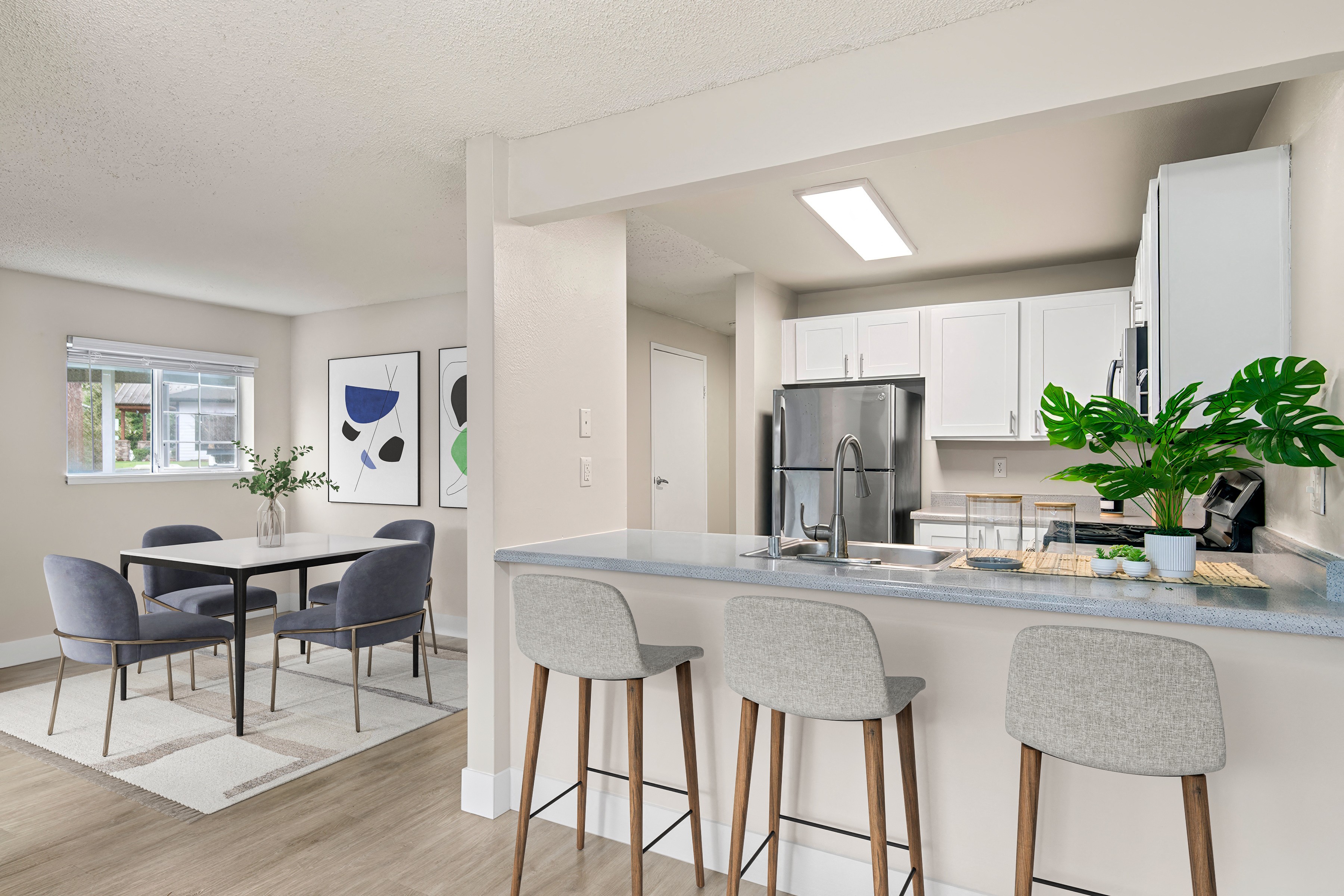 an open kitchen and dining room with a table and chairs